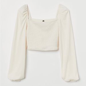 Smocked top with long puffy sleeves